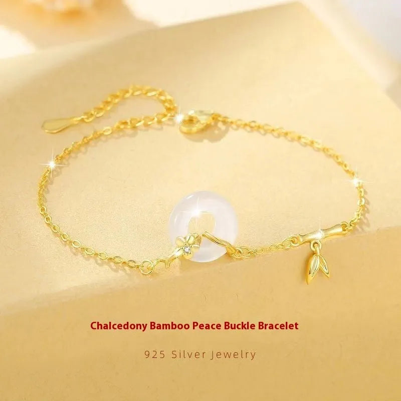 Silver white chalcedony bracelet with starry sky design and peace buckle on a neutral background