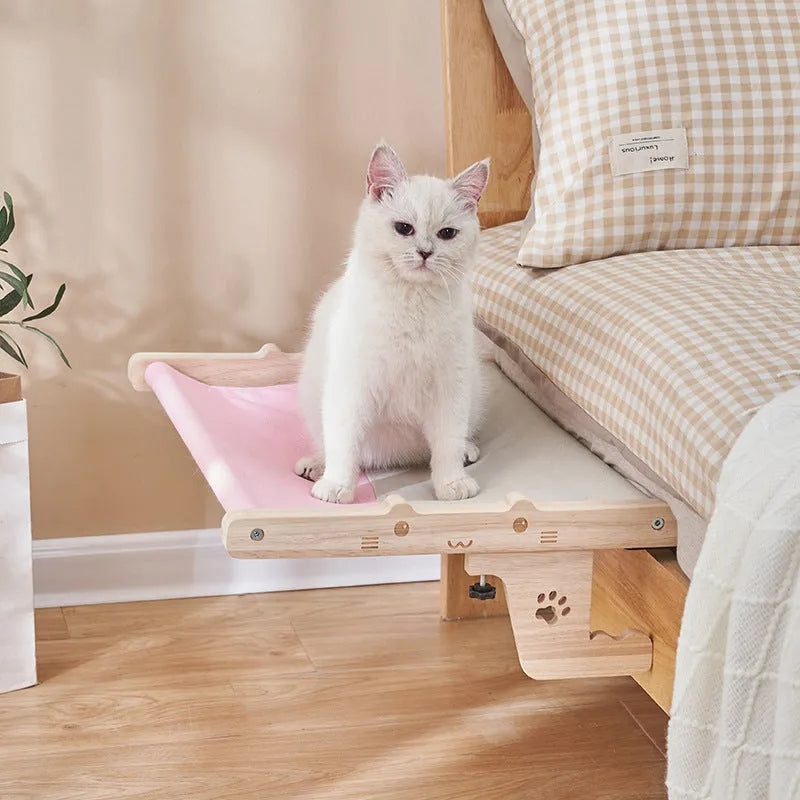 Wooden frame cat hanging bed with patterned removable cushion mounted on window