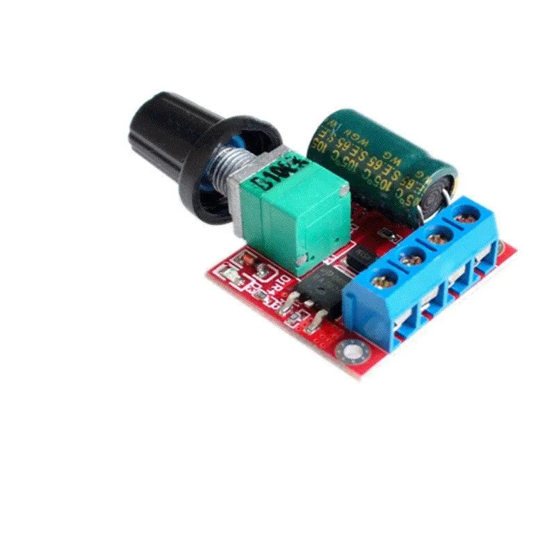 Small green PCB DC motor governor with black potentiometer knob for 5V-35V speed control