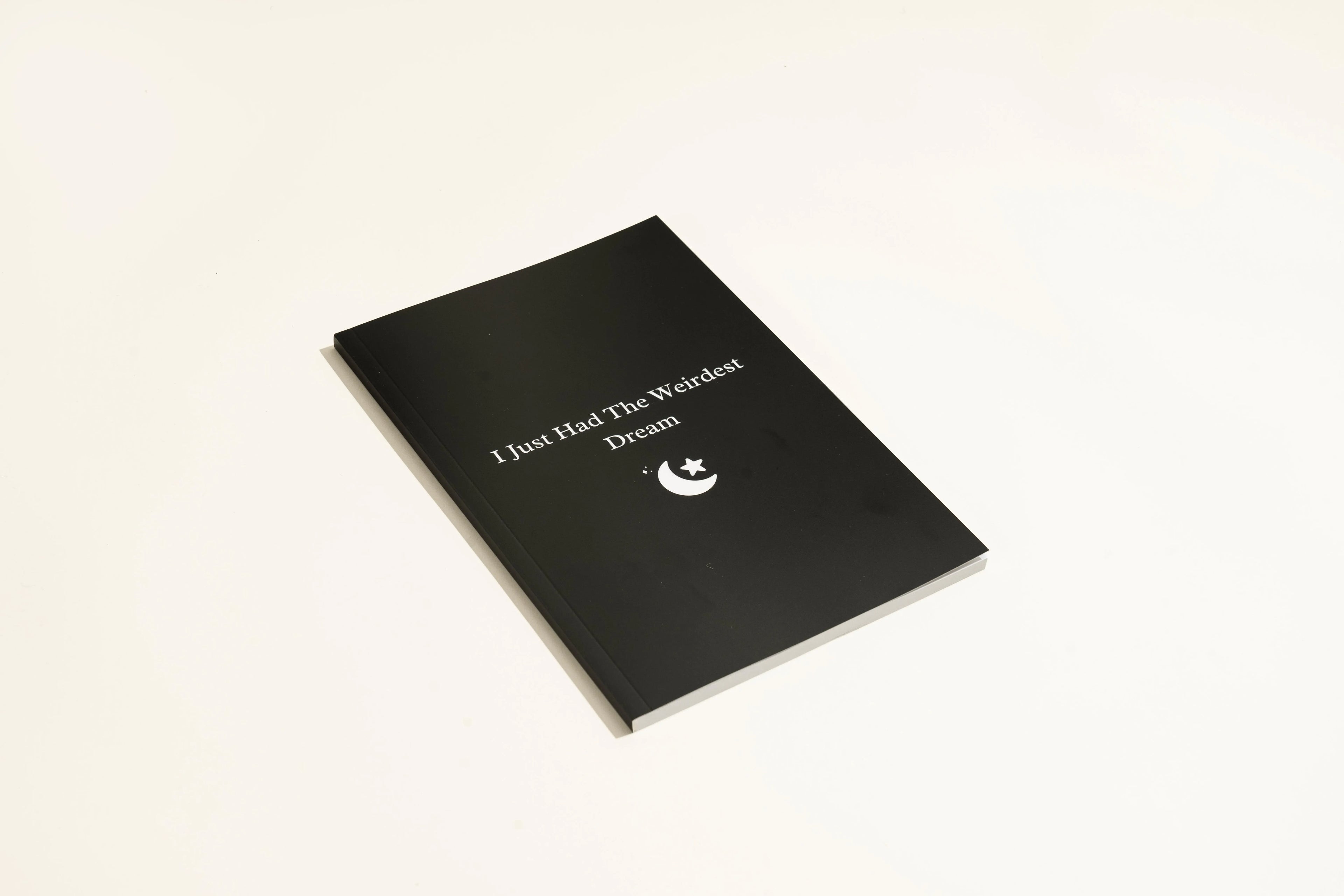Black hardback A5 dream journal notebook with business simplicity style and ruled interior pages