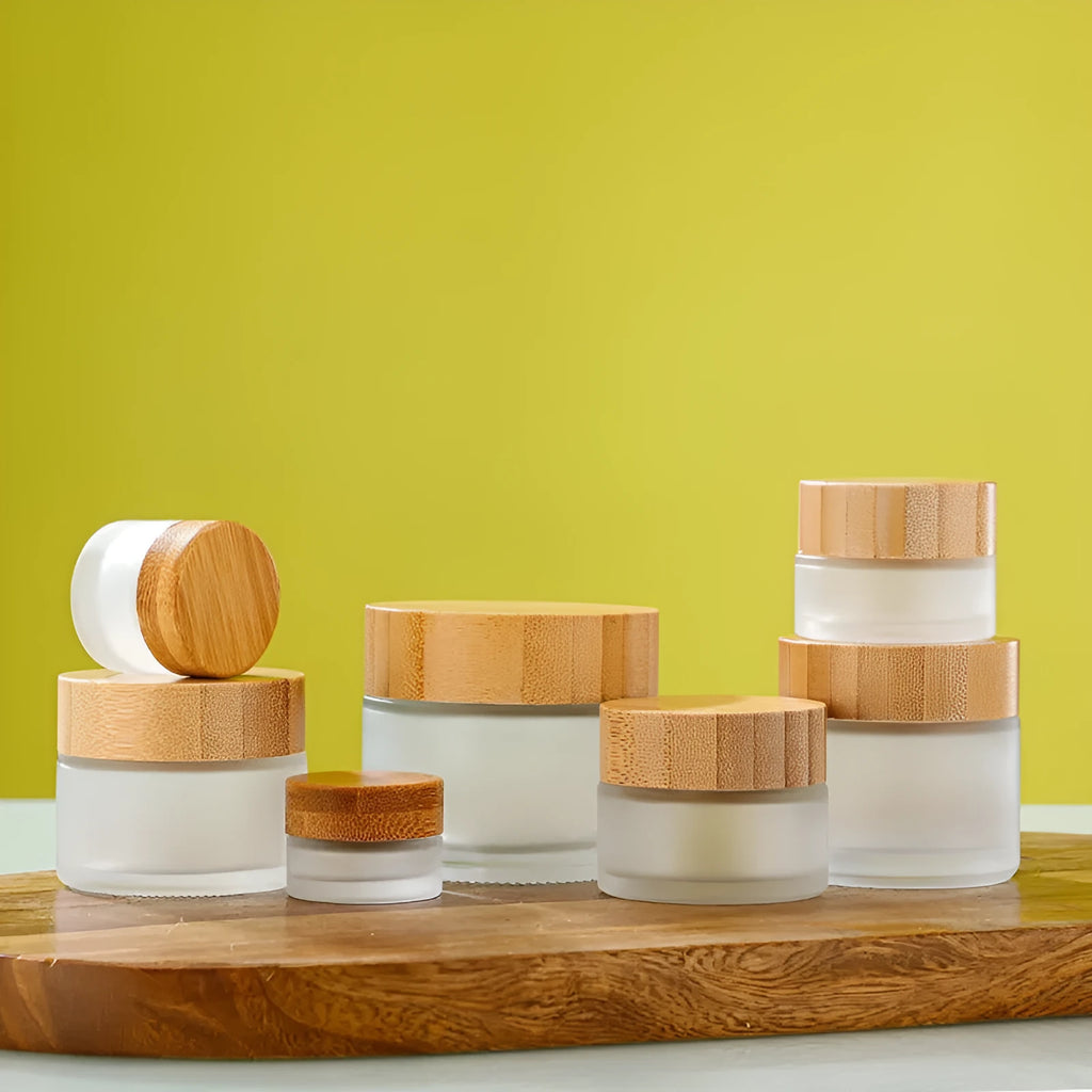 Glass sub-bottle with bamboo wood cover for travel cream in 50g size, transparent finish