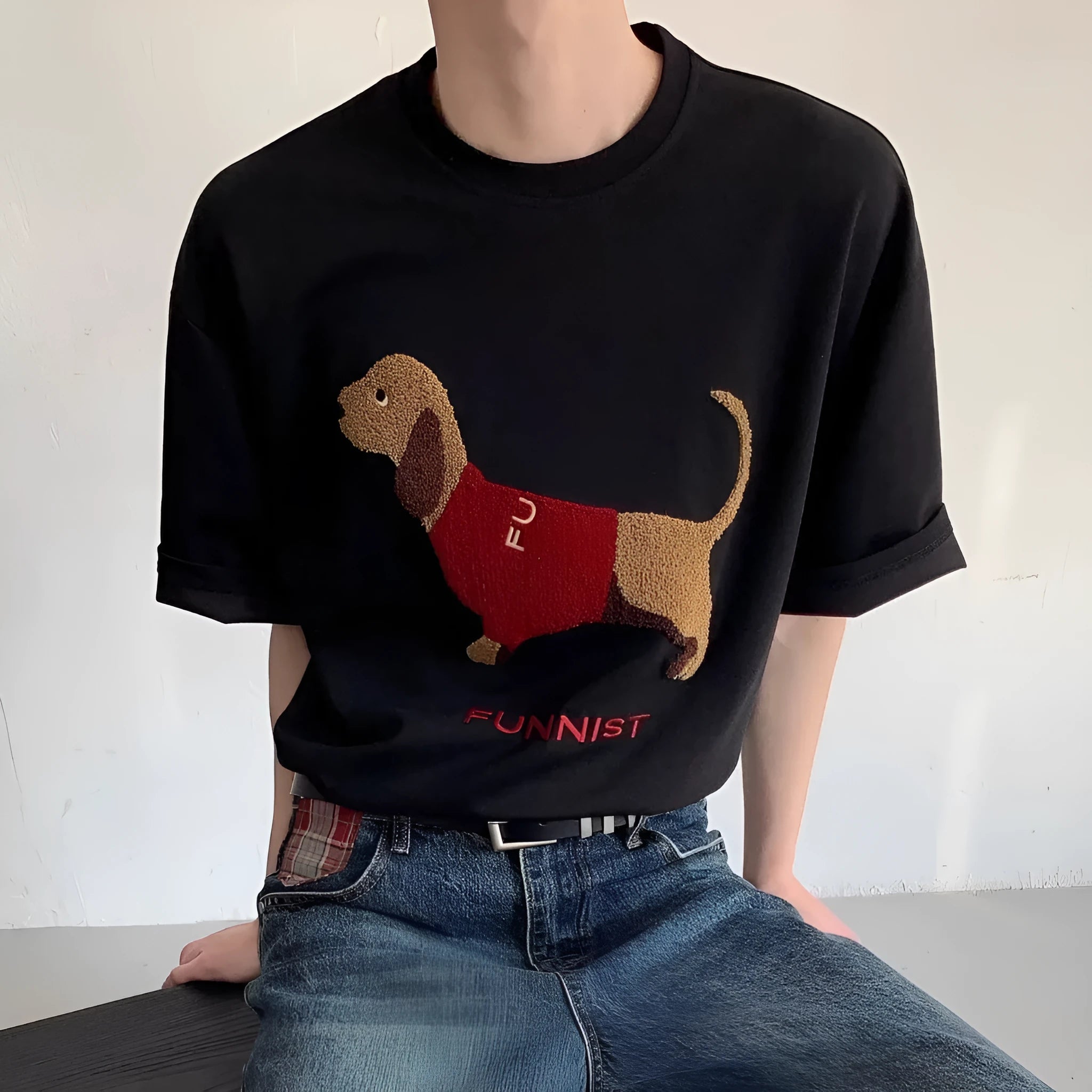 Grey men's cotton t-shirt with embroidered dachshund dog holding a towel graphic.