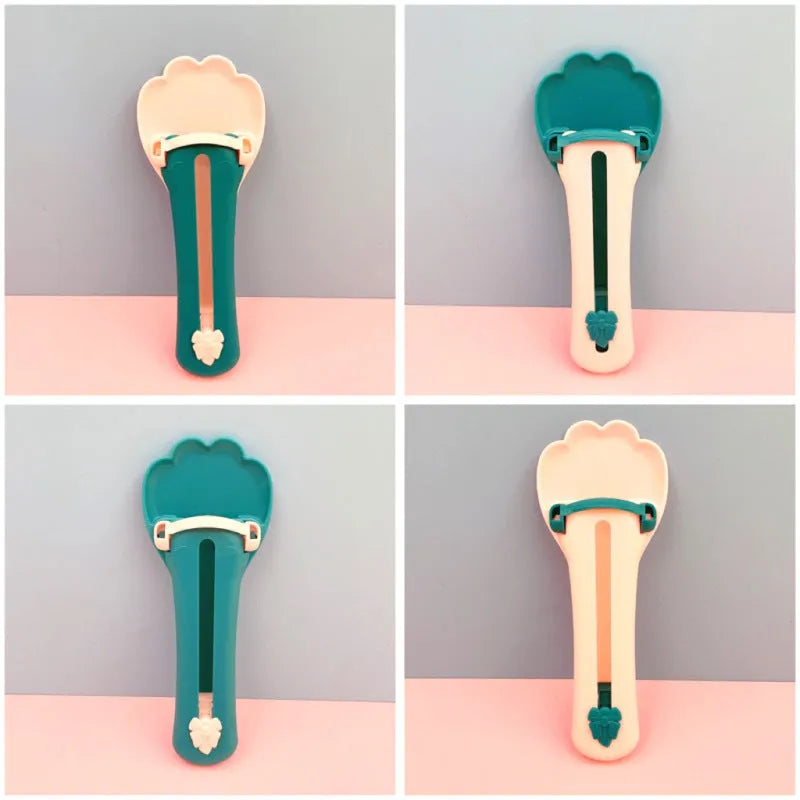Green pet food scoop with transparent 25 ml chamber and wide handle for dispensing liquid food.
