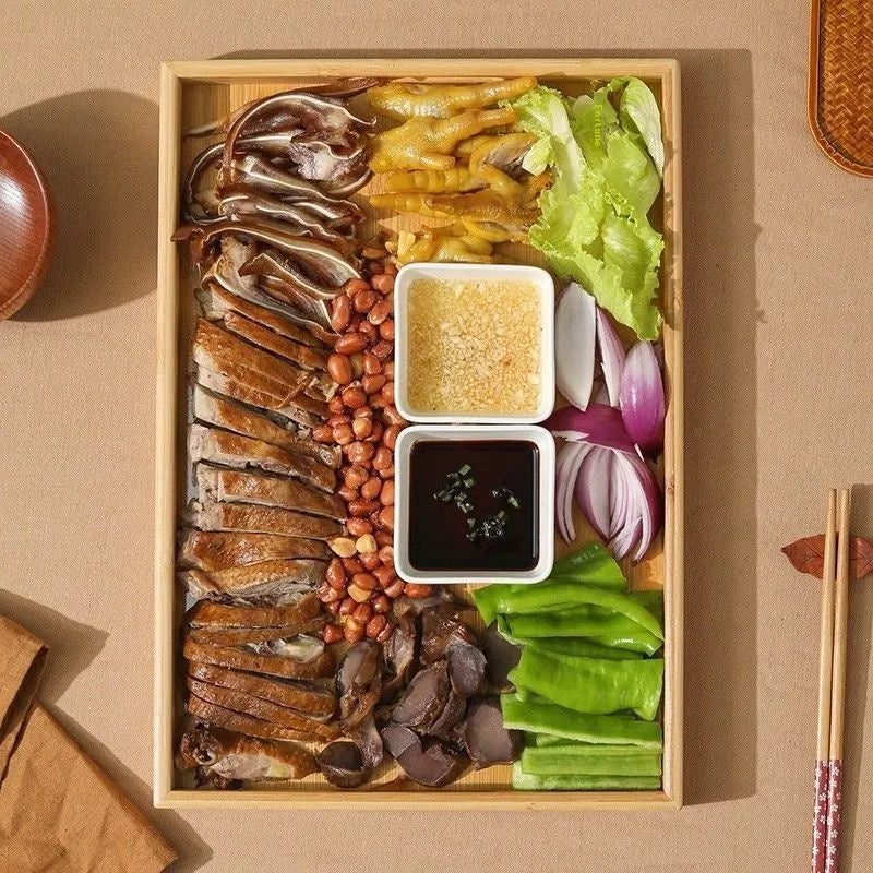 Brown-handle bamboo square serving tray on a table