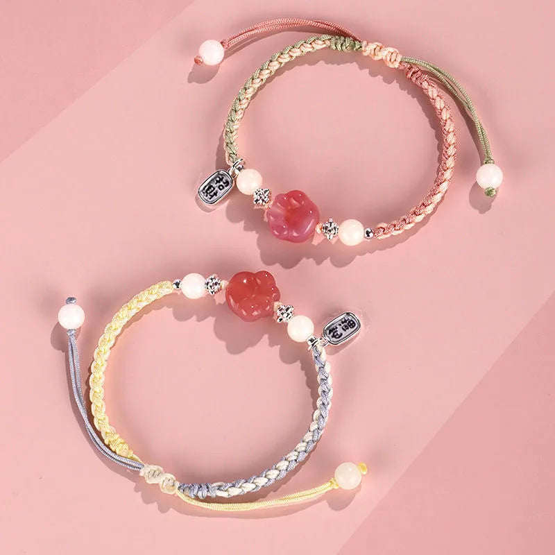 Handmade glass and coloured glaze cat's paw woven bracelet for couples in red, pink, or yellow