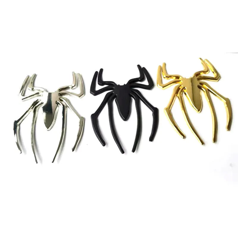 3D metal spider car bumper sticker in gold, silver, black, or red on a white background