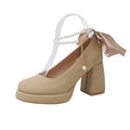 Beige women's Mary Jane shoes with chunky heel, ankle strap buckle, and pearl decoration on round toe