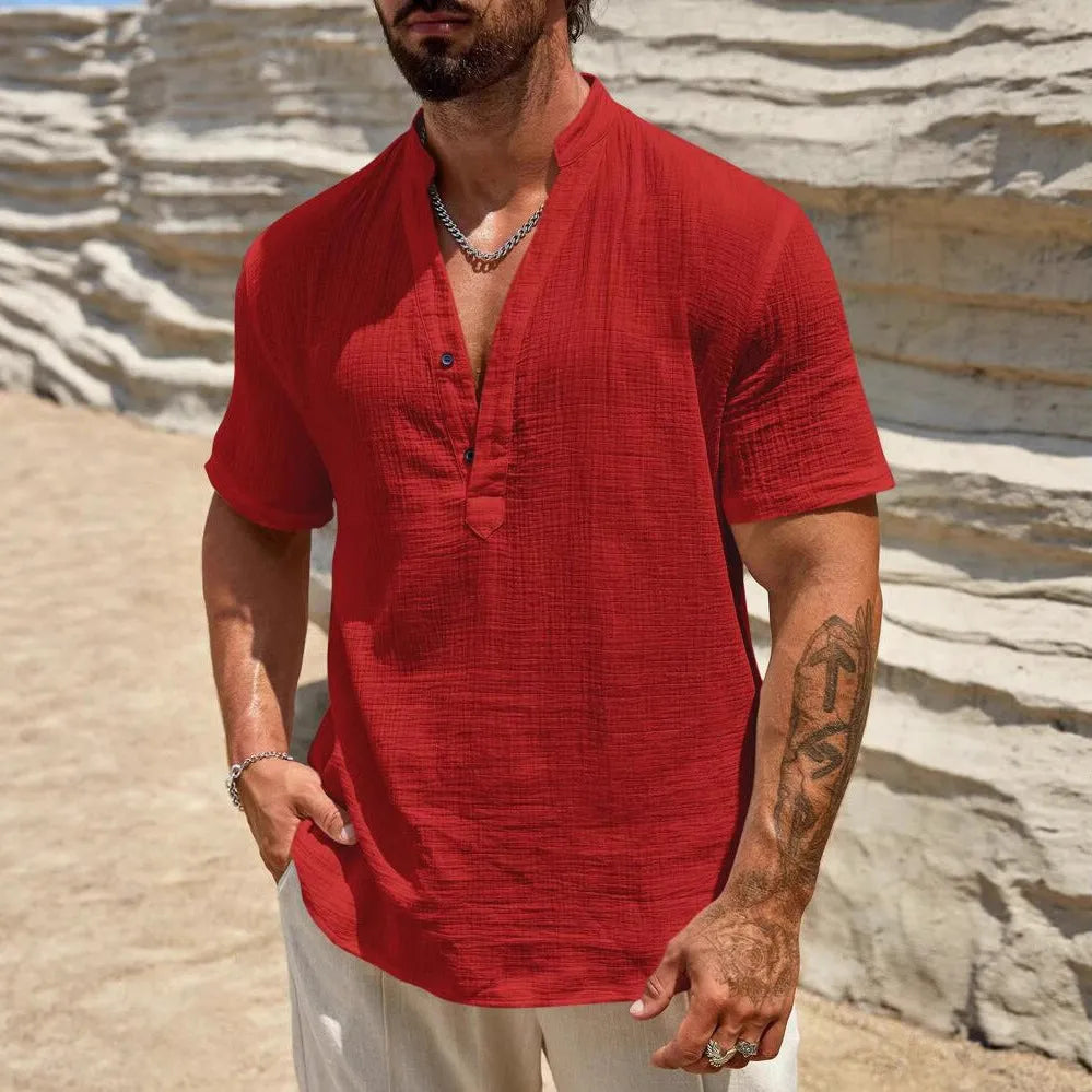 Men's solid colour short-sleeved shirt with stand collar in light blue, laid flat.