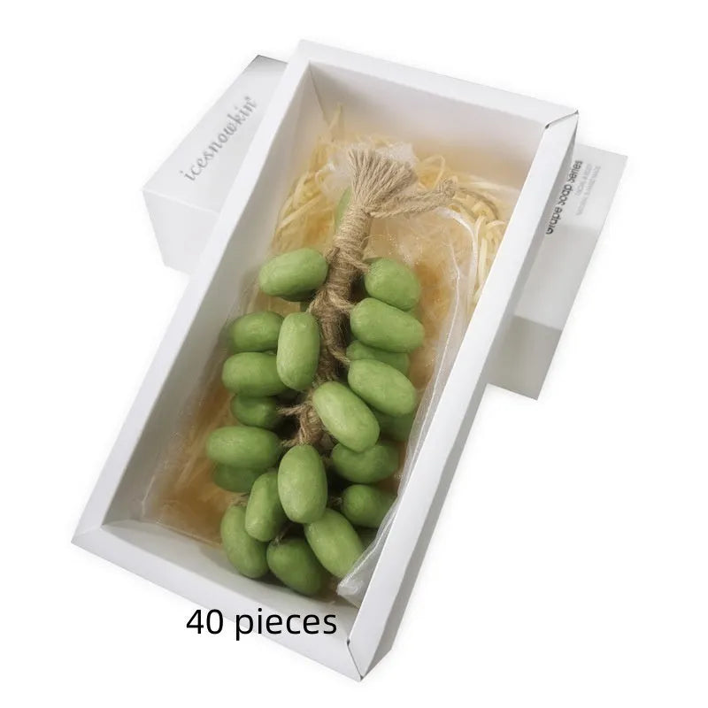Handmade grape and litchi cleansing soap bars in gift box and mesh bag packaging.