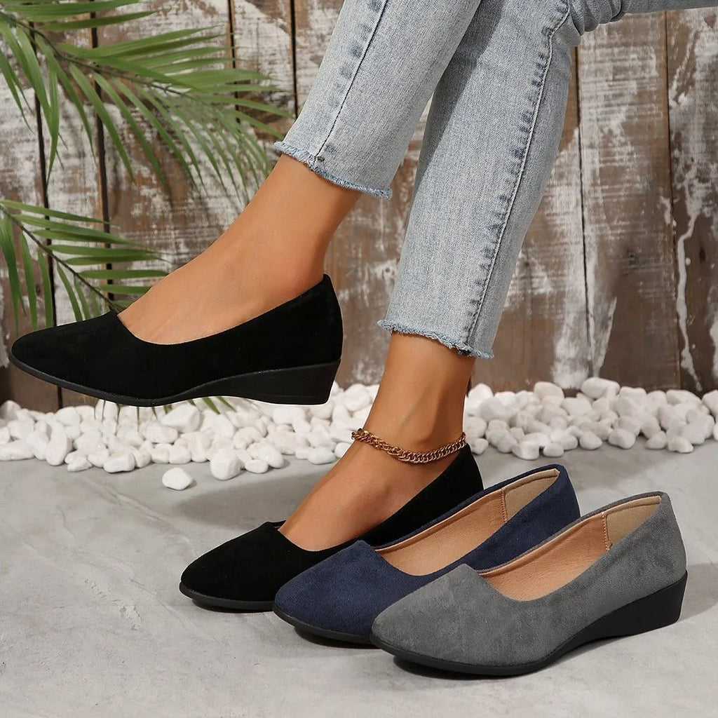 Women's plus size low wedge pump in suede with pointed toe, shown in light brown colour.