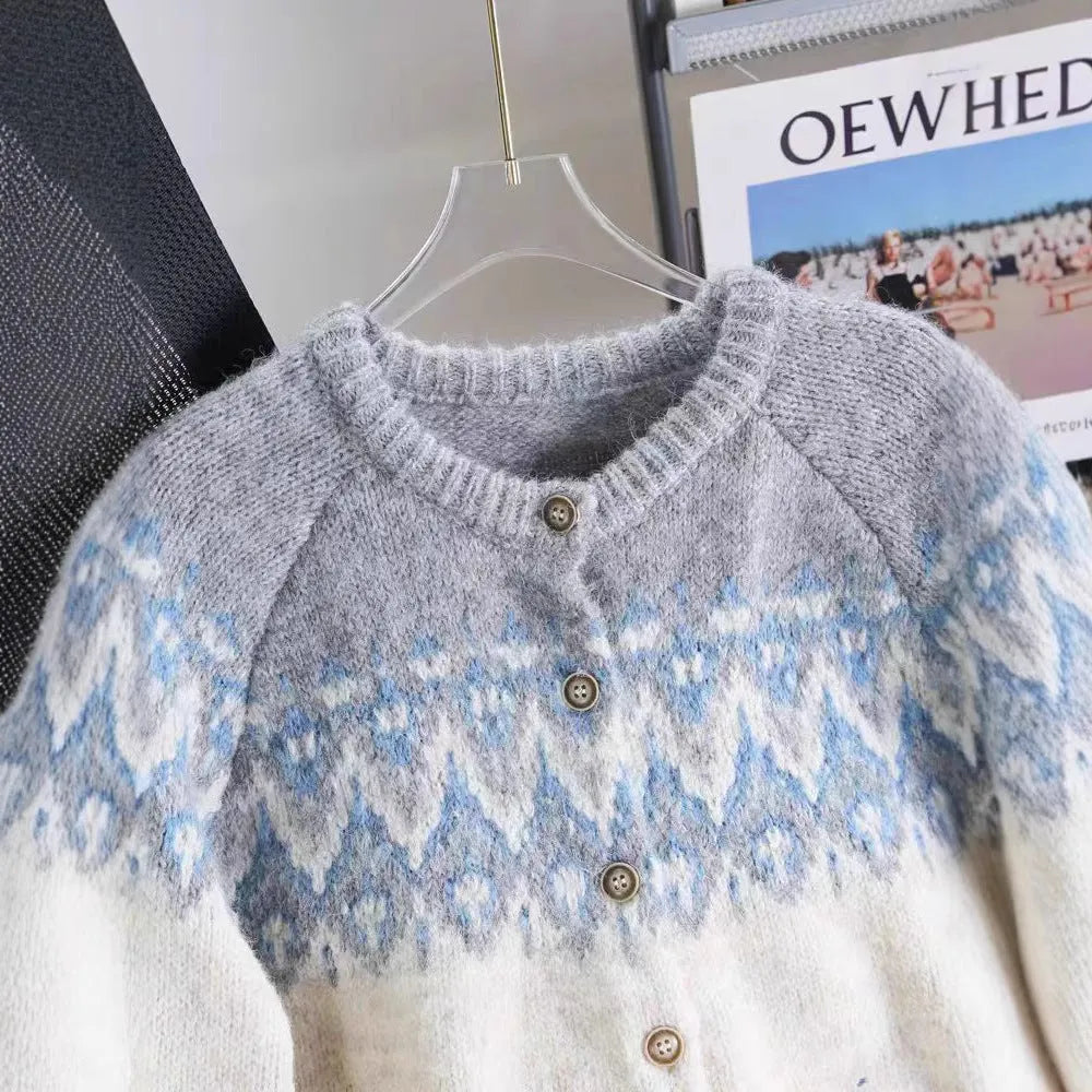 Women's jacquard knit sweater coat in a contrast colour, shown in a loose fit.