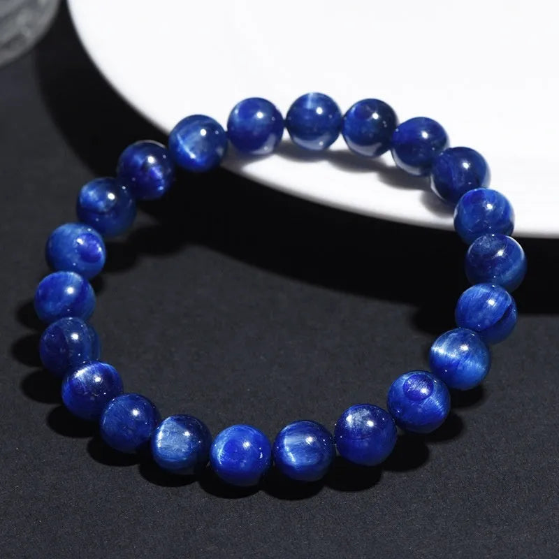 Blue crystal bracelet with geometric shape and Ruyi design element on wrist