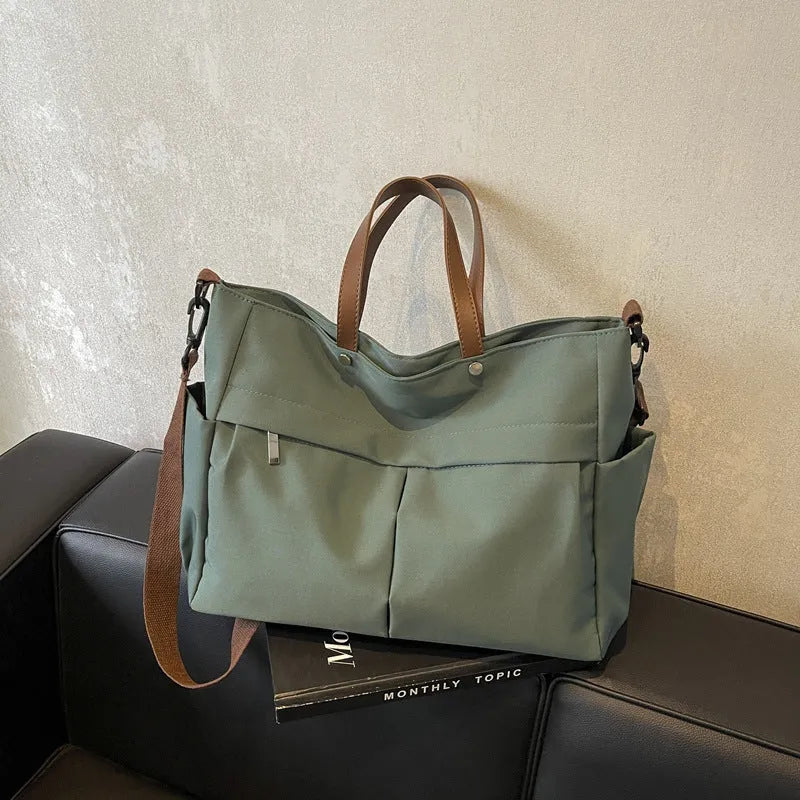 Nylon crossbody tote bag in milky white with short shoulder strap and flat base