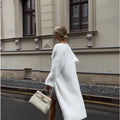 White long length women's cardigan sweater jacket with loose fit and regular sleeves