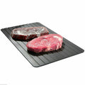 Black aluminium fast defrost tray 23x16.5cm on a countertop
