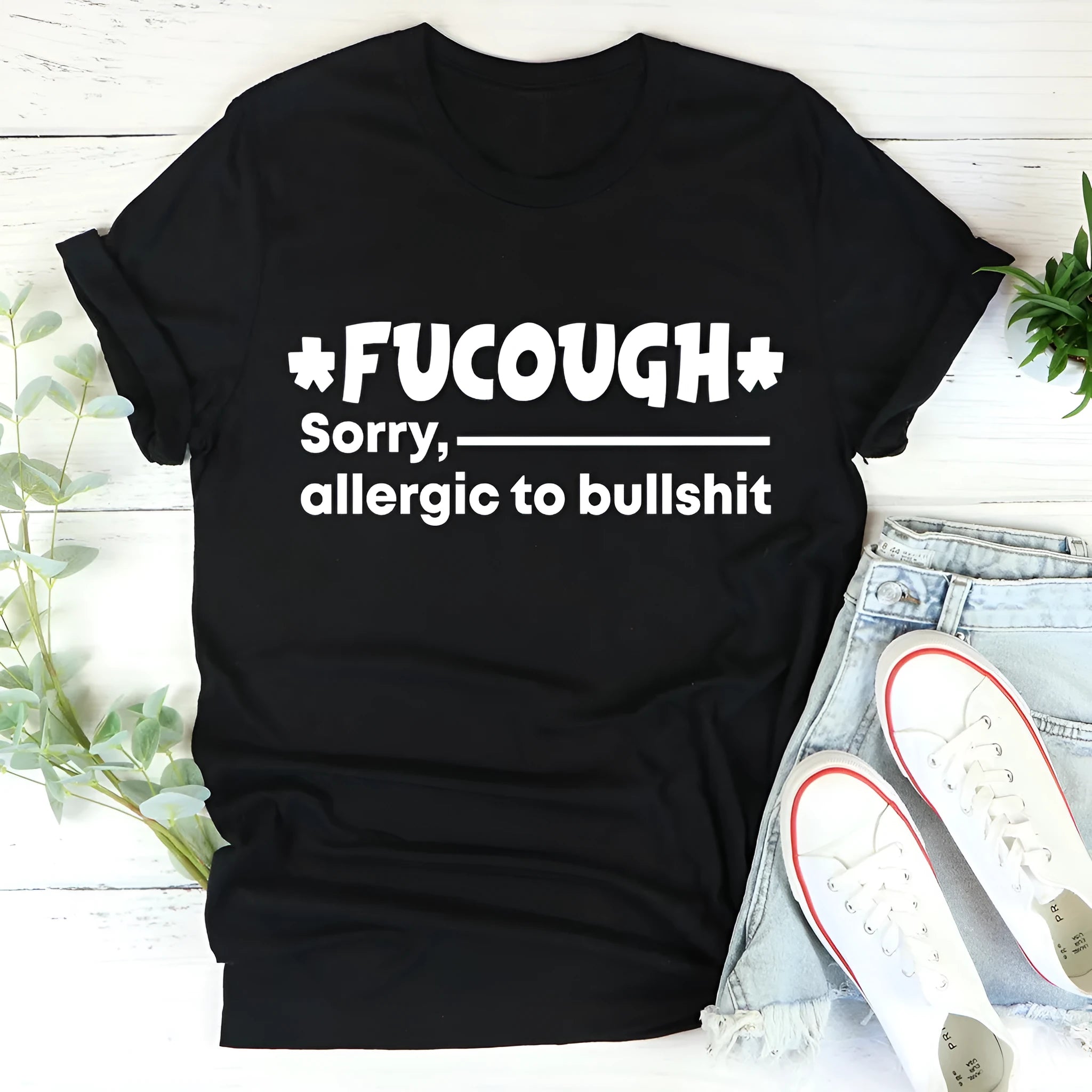 Black cotton T-shirt with round neck and short sleeves on hanger