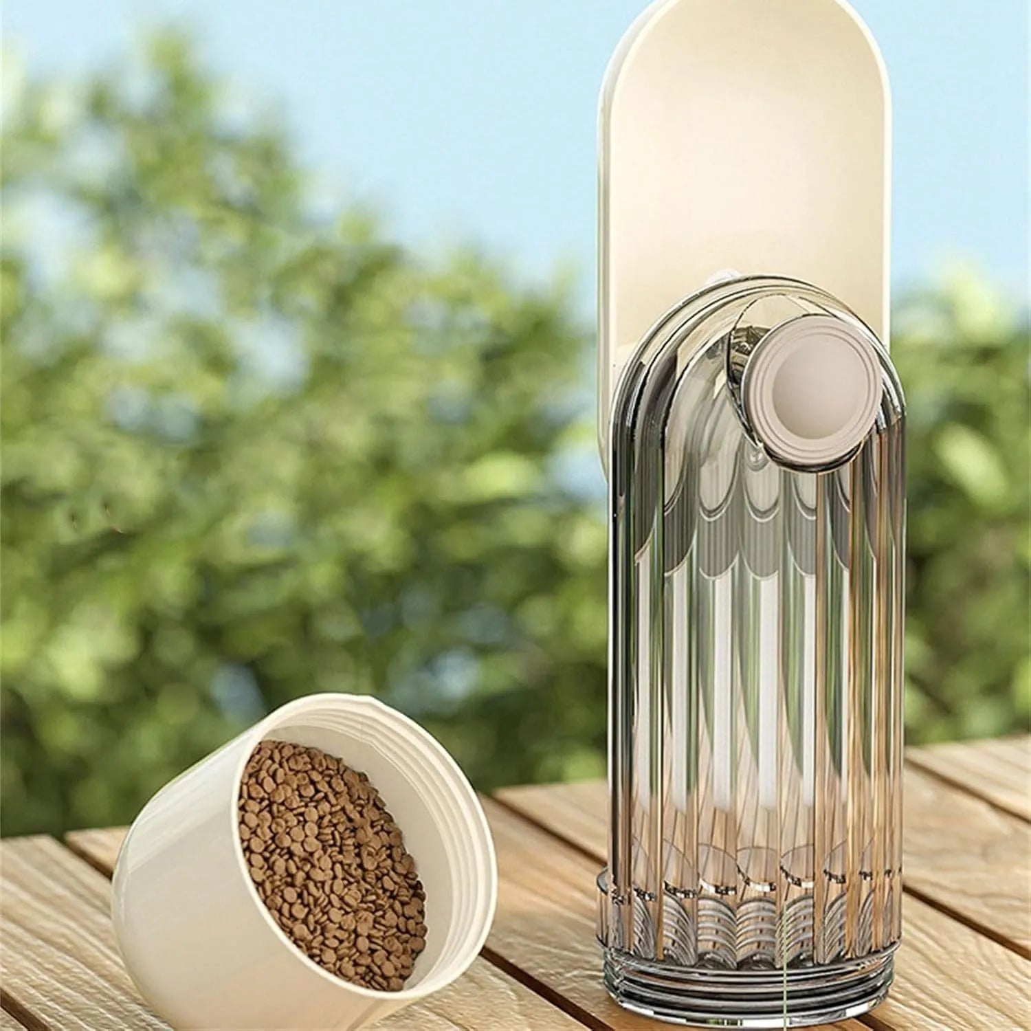 Beige foldable dog water bottle and food dispenser with leak-proof design for outdoor use
