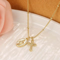 Gold geometric cross necklace with Virgin Mary ornament on a simple chain.