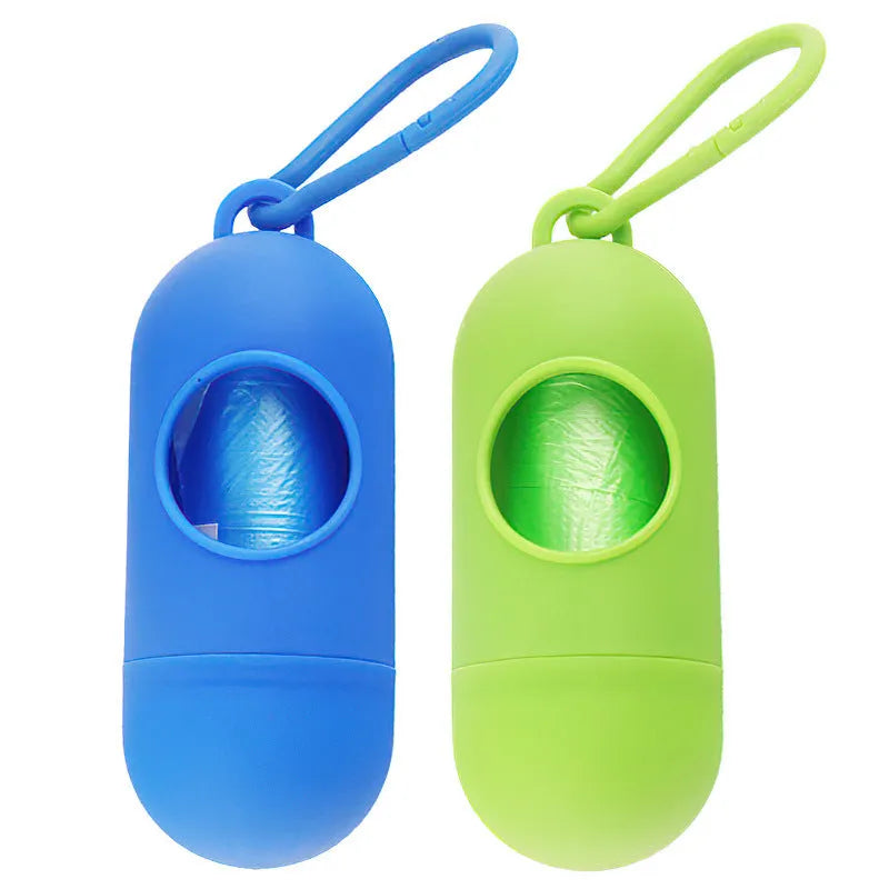 Compact black dog waste bag dispenser holder with metal hook and Velcro strap.