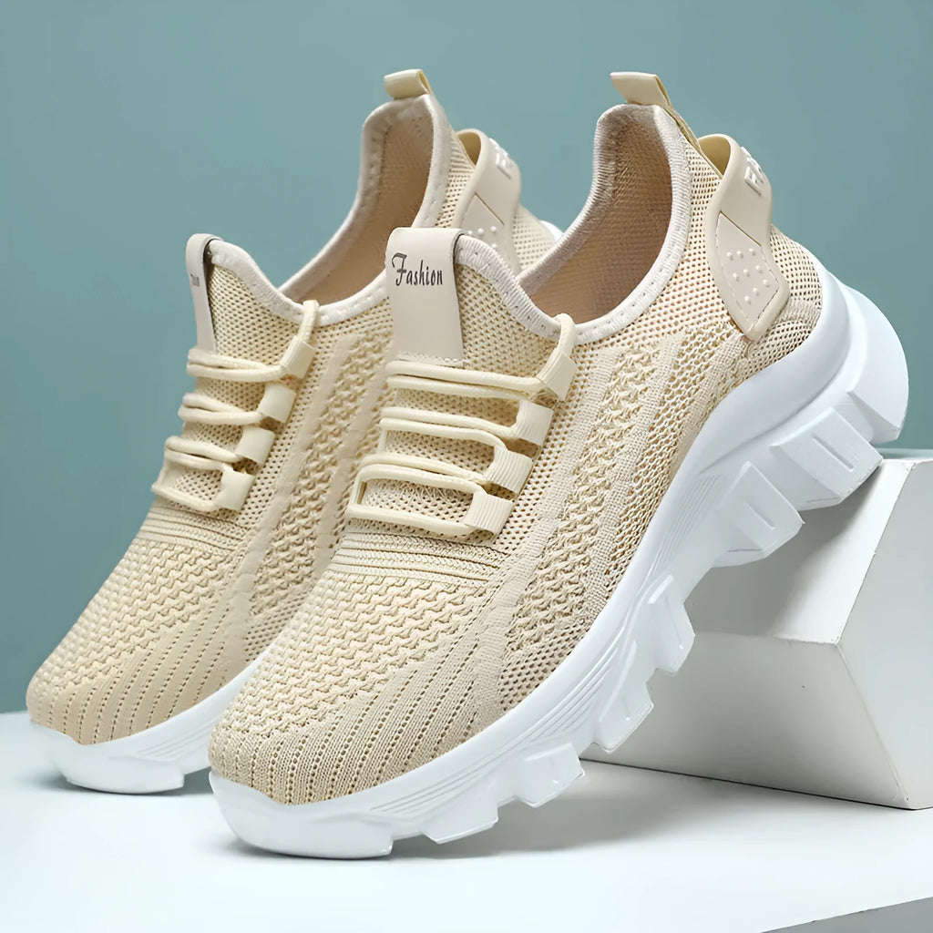 Women's white Flyknit running shoes with a thick PVC sole and lace-up front.
