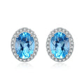925 sterling silver jewellery set with blue topaz gems showing earrings, ring, pendant, and necklace with geometric design