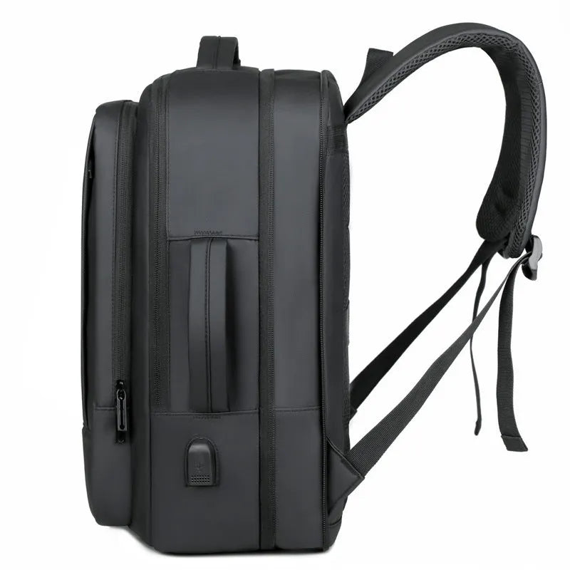 Large capacity black backpack for business travel and outdoor use with curved shoulder straps