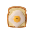 Yellow and green dog latex toy with cartoon pattern egg bread shape, bite resistant squeaky chew for puppies