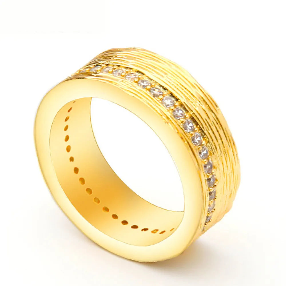 Gold-coloured geometric zircon ring for women with angular design on copper base metal