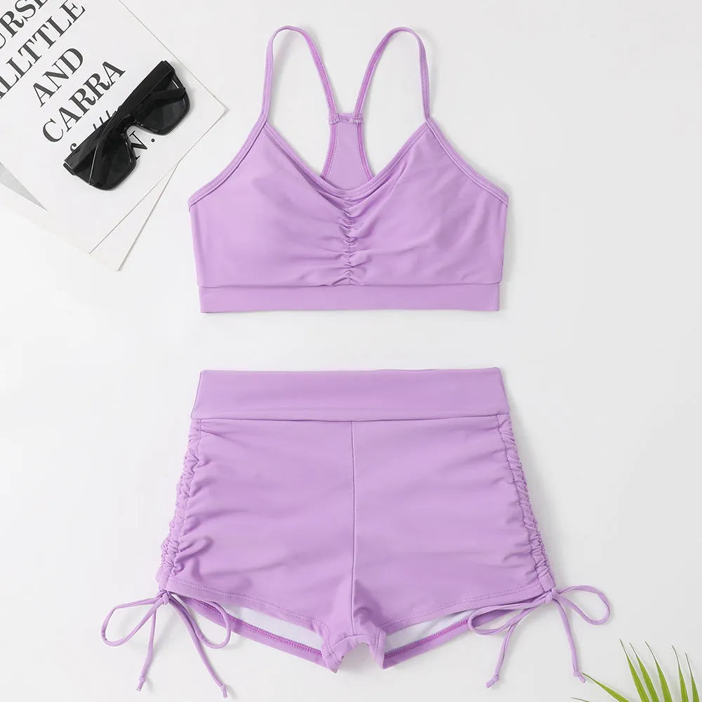 Women's solid purple high-waisted split swimsuit bikini with sleeveless design for swimming and surfing
