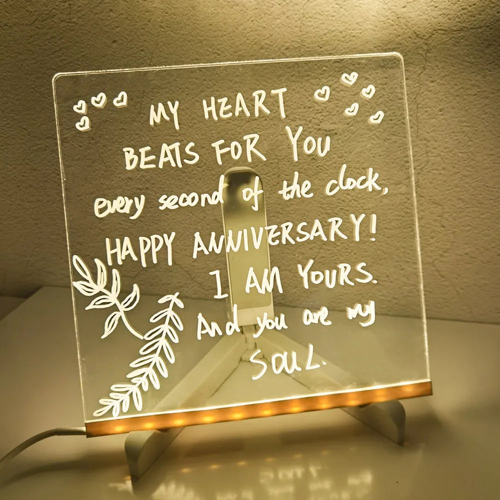 Acrylic DIY note board LED night light showing a transparent board with written messages, USB power, and bracket setup