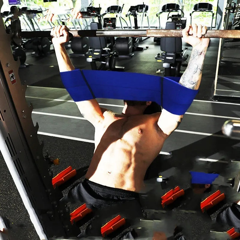 Elastic elbow support bandage for boxing in red, shown in a medium size.