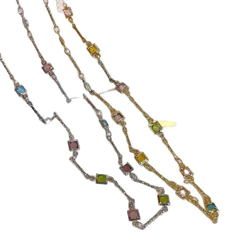 Square colour geometric quadrilateral alloy clavicle chain necklace with artificial crystal details on a model.