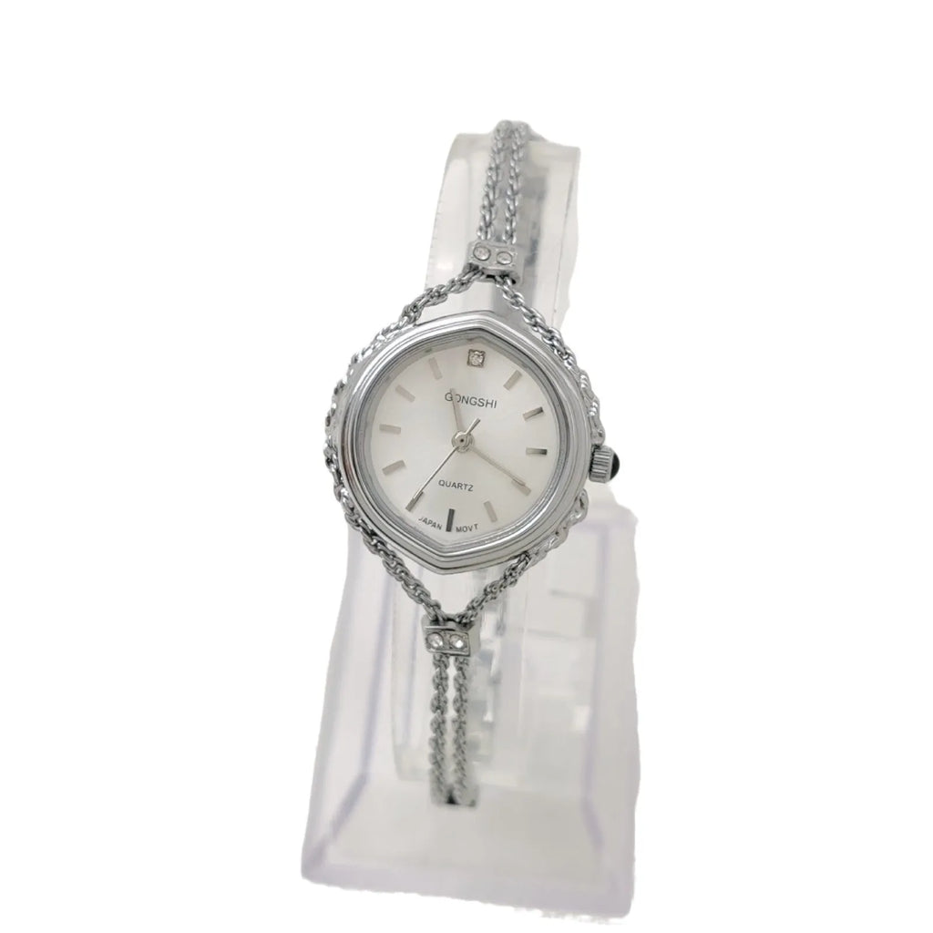 Women's quartz watch with gold copper plating, 25mm dial, mineral glass mirror, and metal chain strap on white background