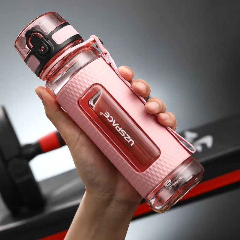 Portable sport water bottle in blue, copolymer polyester plastic, 1100ml capacity, with black cap.