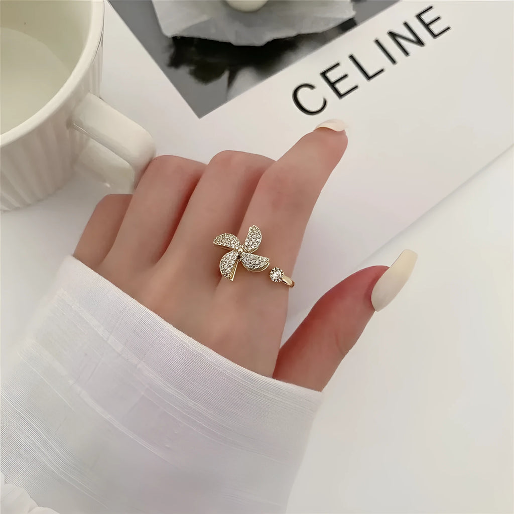 Copper rotating ring with windmill design in gold or silver electroplated finish