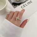 Copper rotating ring with windmill design in gold or silver electroplated finish