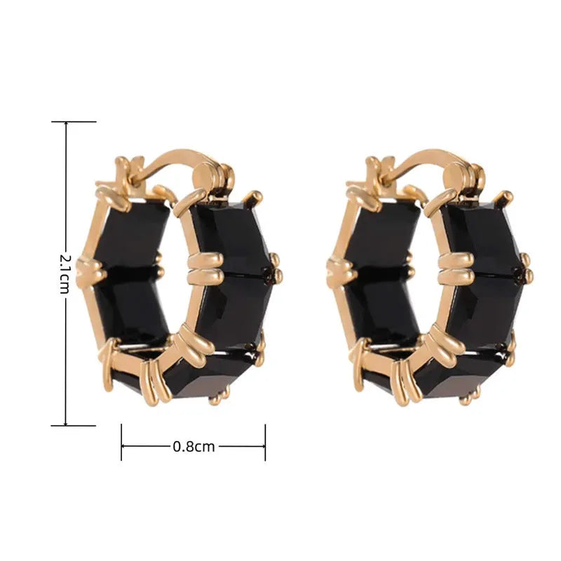 Geometric U-shaped gold earrings with round black zircon crystals