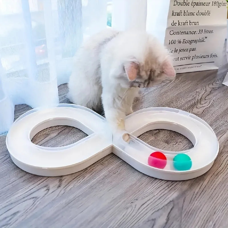 Blue and white cat turntable track ball toy with teasing stick on a flat surface.