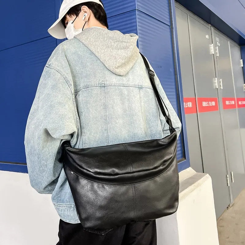 Retro large capacity men's crossbody bag in brown, black, and white PU leather with waterproof feature