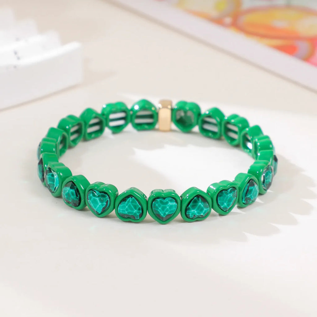 Rainbow enamel alloy heart stretch bracelet in TCSL003 colour variant on a white background