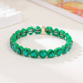 Rainbow enamel alloy heart stretch bracelet in TCSL003 colour variant on a white background