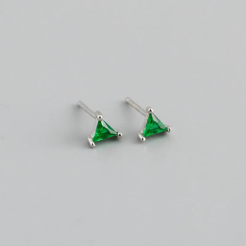 Simple triangle colour zircon stud earrings in 925 sterling silver with blue stone and gold needle on white background