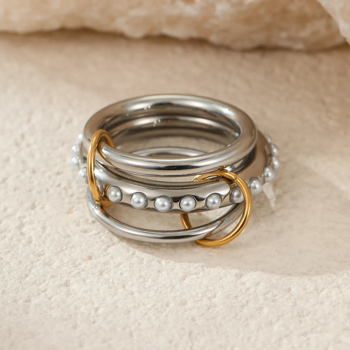 Stacked stainless steel rings with 18K gold plating in colour matching design