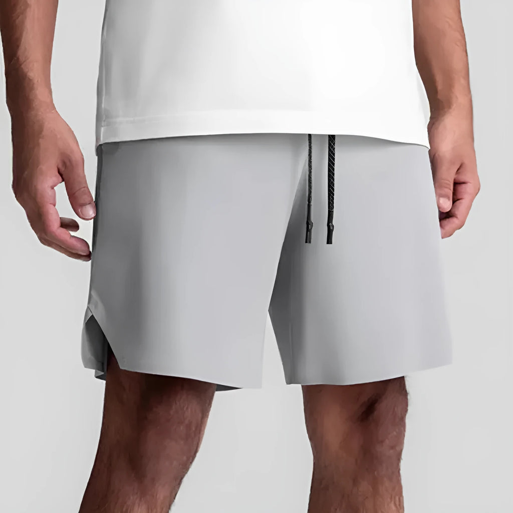 Men's seamless quick-drying sports shorts in black with multi-bag design, shown straight-leg cut