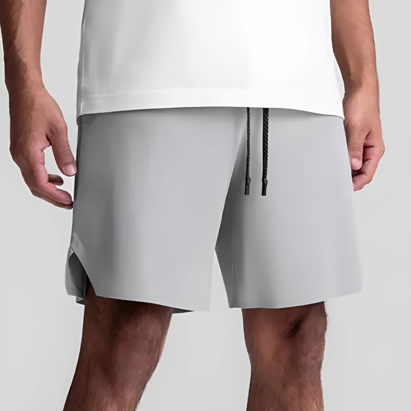 Men's seamless quick-drying sports shorts in black with multi-bag design, shown straight-leg cut