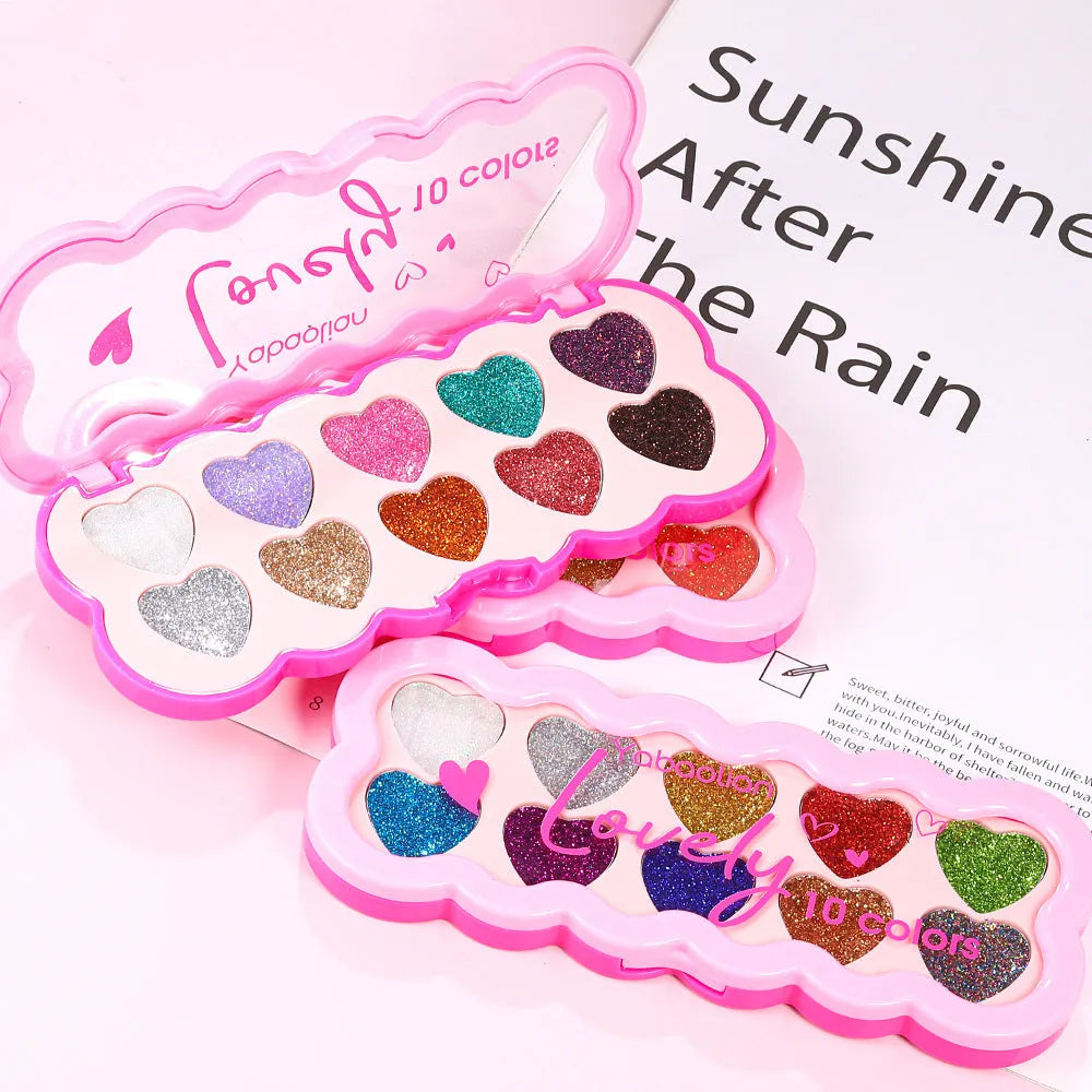 Pearlescent heart-shaped makeup palette open to show ten different coloured eyeshadows.