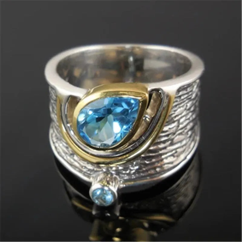 Close-up of a blue drop-shaped zircon rhinestone set in a creative Chinese style alloy women's ring.