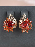 Round floral feather earrings with zircon stone centre in champagne gold finish, available in six coloured diamond options