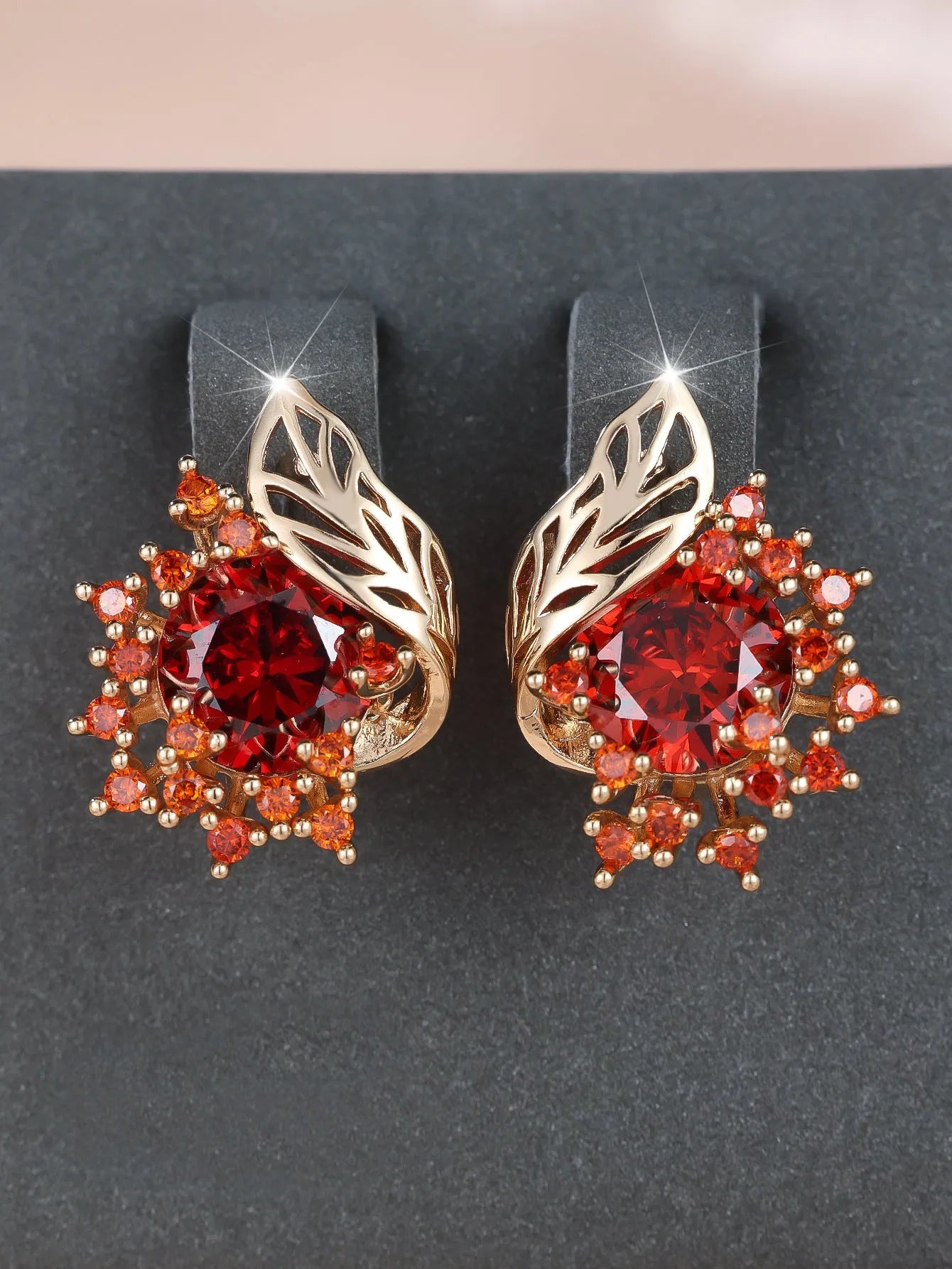 Round floral feather earrings with zircon stone centre in champagne gold finish, available in six coloured diamond options