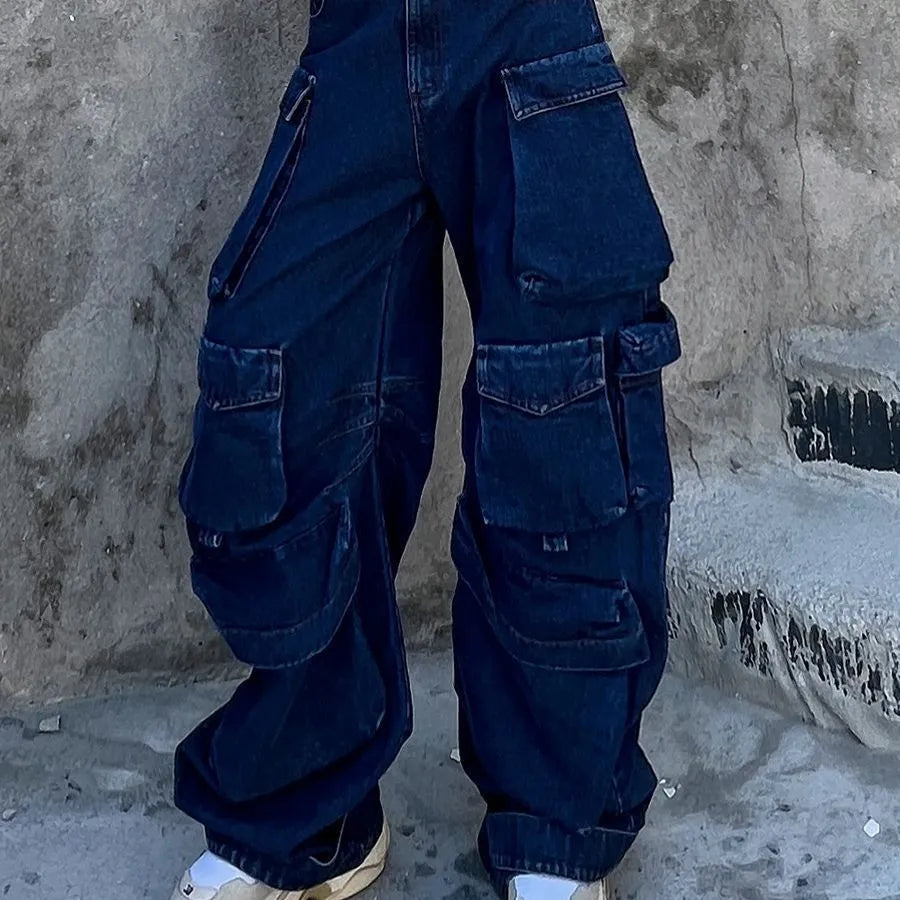 Dark blue distressed women's jeans with wide legs, high waist, and multiple pockets on a neutral background.